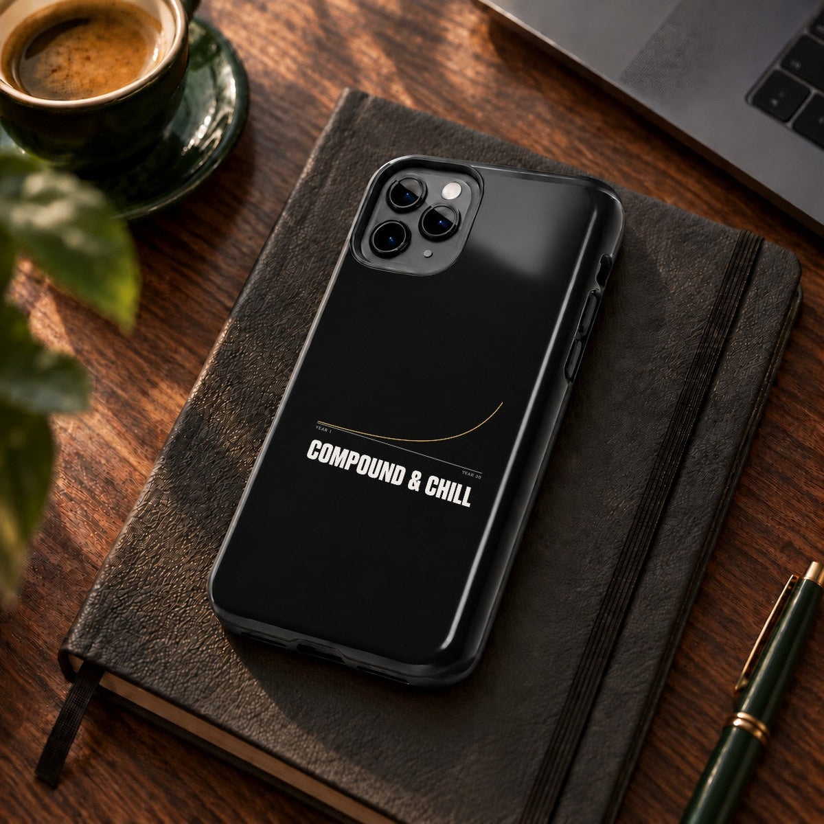 Compound and Chill phone case on a desk with coffee and a notebook