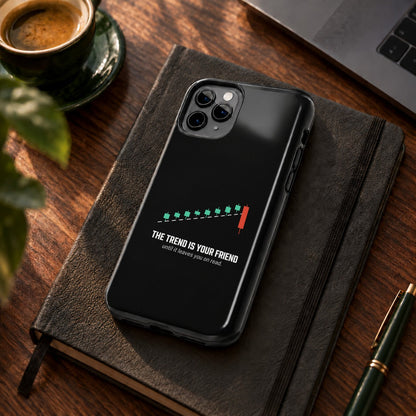 The Trend Is Your Friend phone case on a desk with coffee and a notebook